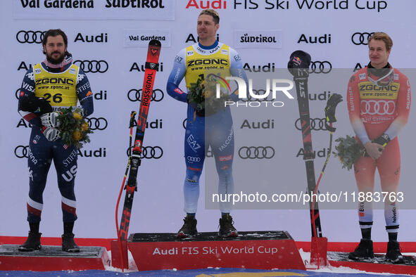 (From left to right) Jared Goldberg of Team United States in second place, Mattia Casse of Team Italy in first place, and Marco Odermatt of...