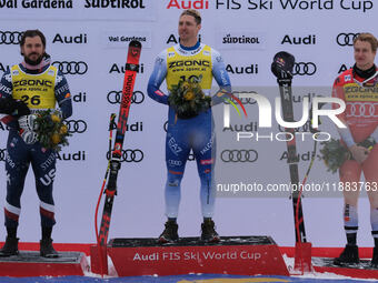 (From left to right) Jared Goldberg of Team United States in second place, Mattia Casse of Team Italy in first place, and Marco Odermatt of...