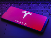 The Tesla, Inc. logo appears on a smartphone screen in this illustration photo in Reno, United States, on December 20, 2024. (