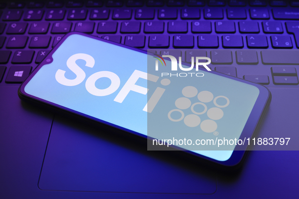 The SoFi Technologies, Inc. logo appears on a smartphone screen in this illustration photo in Reno, United States, on December 20, 2024. 