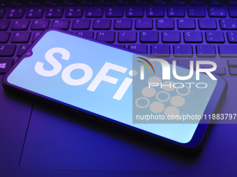 The SoFi Technologies, Inc. logo appears on a smartphone screen in this illustration photo in Reno, United States, on December 20, 2024. (