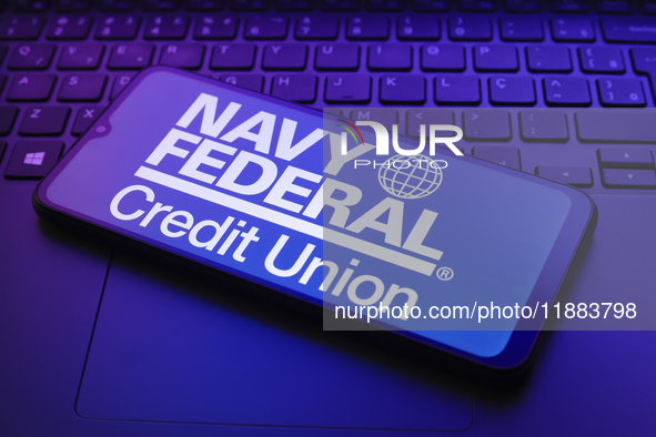 The Navy Federal Credit Union logo appears on a smartphone screen in this illustration photo in Reno, United States, on December 20, 2024. 