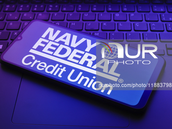 The Navy Federal Credit Union logo appears on a smartphone screen in this illustration photo in Reno, United States, on December 20, 2024. (