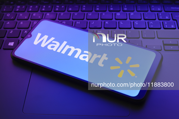 The Walmart, Inc. logo appears on a smartphone screen in this illustration photo in Reno, United States, on December 20, 2024. 