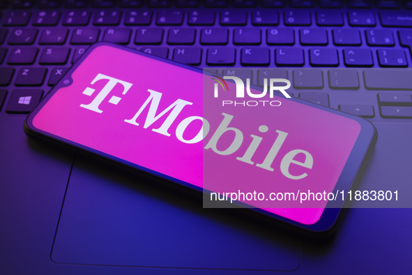 The T-Mobile logo appears on a smartphone screen in this illustration photo in Reno, United States, on December 20, 2024. 