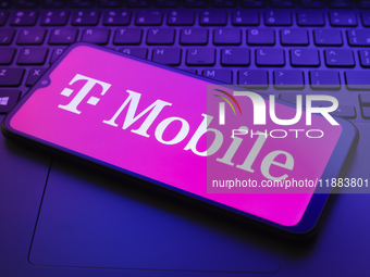 The T-Mobile logo appears on a smartphone screen in this illustration photo in Reno, United States, on December 20, 2024. (