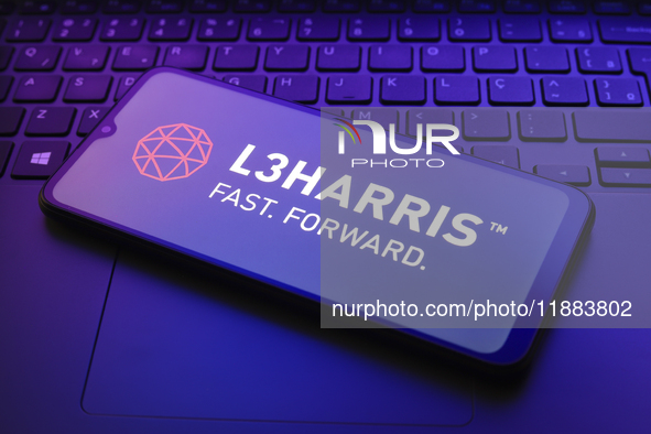 The L3Harris logo appears on a smartphone screen in this illustration photo in Reno, United States, on December 20, 2024. 