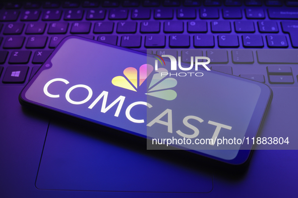 The Comcast Corporation logo appears on a smartphone screen in this illustration photo in Reno, United States, on December 20, 2024. 