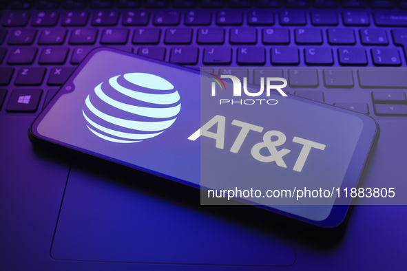 The AT&T logo appears on a smartphone screen in this illustration photo in Reno, United States, on December 20, 2024. 