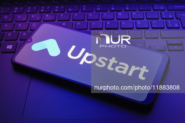 The Upstart Holdings, Inc. logo appears on a smartphone screen in this illustration photo in Reno, United States, on December 20, 2024. 