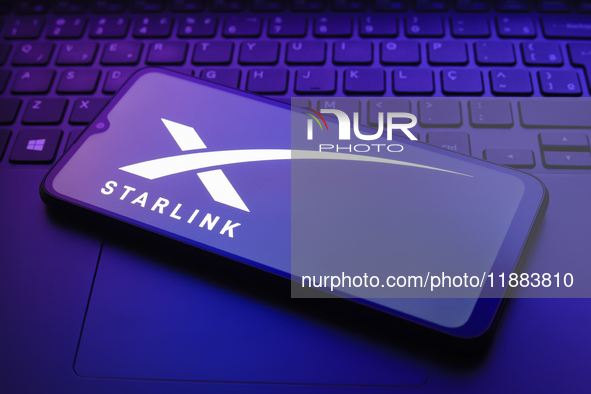 The Starlink logo appears on a smartphone screen in this illustration photo in Reno, United States, on December 20, 2024. 