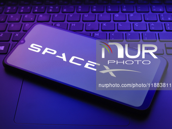 The Space Exploration Technologies Corp. (SpaceX) logo appears on a smartphone screen in this illustration photo in Reno, United States, on...