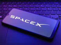 The Space Exploration Technologies Corp. (SpaceX) logo appears on a smartphone screen in this illustration photo in Reno, United States, on...