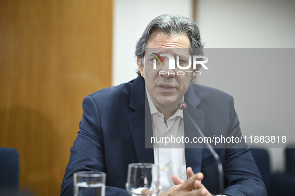 Finance Minister Fernando Haddad talks to journalists during a breakfast at the Finance Ministry in Brasilia, Brazil, on December 20, 2024. 