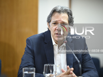 Finance Minister Fernando Haddad talks to journalists during a breakfast at the Finance Ministry in Brasilia, Brazil, on December 20, 2024....