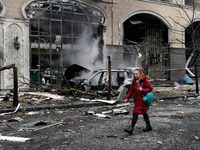 A woman walks along a street in the Holosiivskyi district covered with rubble after a Russian missile attack in Kyiv, Ukraine, on December 2...