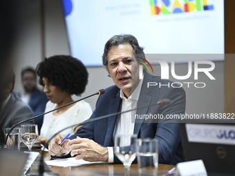 Finance Minister Fernando Haddad talks to journalists during a breakfast at the Finance Ministry in Brasilia, Brazil, on December 20, 2024....