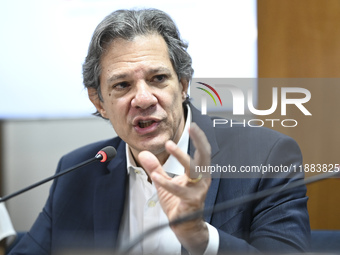 Finance Minister Fernando Haddad talks to journalists during a breakfast at the Finance Ministry in Brasilia, Brazil, on December 20, 2024....