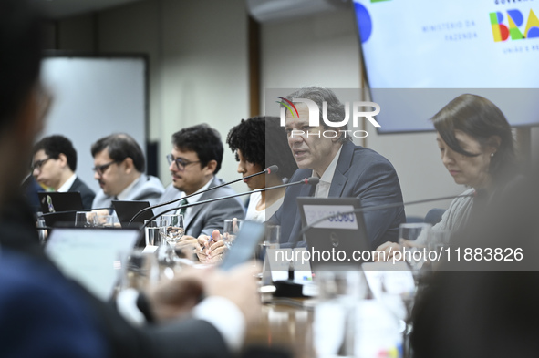 Finance Minister Fernando Haddad talks to journalists during a breakfast at the Finance Ministry in Brasilia, Brazil, on December 20, 2024. 