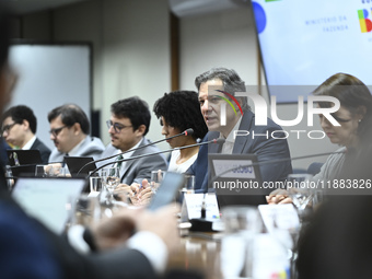 Finance Minister Fernando Haddad talks to journalists during a breakfast at the Finance Ministry in Brasilia, Brazil, on December 20, 2024....