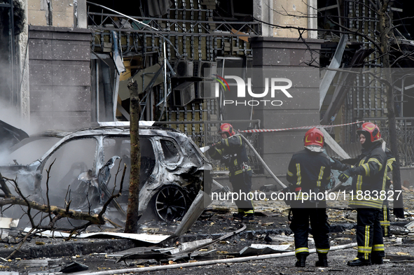 Firefighters put out a burning car in the Holosiivskyi district after a Russian missile attack in Kyiv, Ukraine, on December 20, 2024. On Fr...