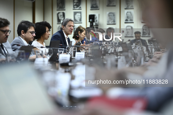 Finance Minister Fernando Haddad talks to journalists during a breakfast at the Finance Ministry in Brasilia, Brazil, on December 20, 2024. 