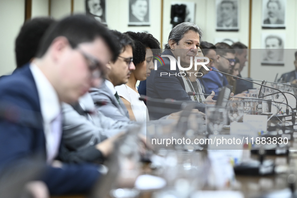 Finance Minister Fernando Haddad talks to journalists during a breakfast at the Finance Ministry in Brasilia, Brazil, on December 20, 2024. 