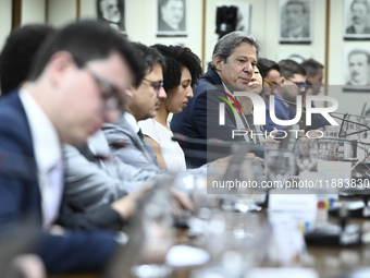 Finance Minister Fernando Haddad talks to journalists during a breakfast at the Finance Ministry in Brasilia, Brazil, on December 20, 2024....