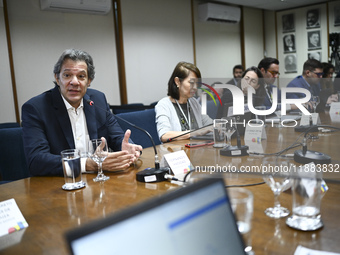 Finance Minister Fernando Haddad talks to journalists during a breakfast at the Finance Ministry in Brasilia, Brazil, on December 20, 2024....