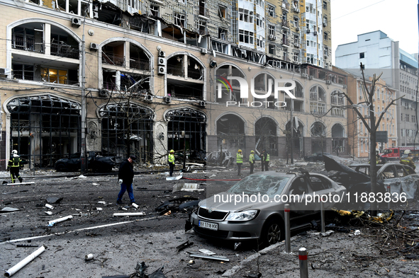 In Kyiv, Ukraine, on December 20, 2024, people stand outside a building in the Holosiivskyi district damaged by a Russian missile attack. On...