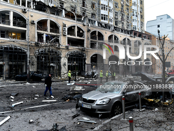 In Kyiv, Ukraine, on December 20, 2024, people stand outside a building in the Holosiivskyi district damaged by a Russian missile attack. On...