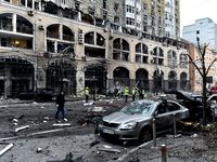 In Kyiv, Ukraine, on December 20, 2024, people stand outside a building in the Holosiivskyi district damaged by a Russian missile attack. On...