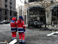 Medics stand outside a building in the Holosiivskyi district damaged by a Russian missile attack in Kyiv, Ukraine, on December 20, 2024. On...