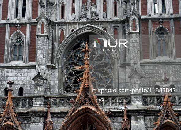 The panes above the entrance to the Roman Catholic Church of Saint Nicholas in Kyiv, Ukraine, on December 20, 2024, are smashed by the shock...