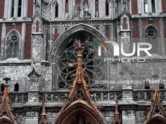 The panes above the entrance to the Roman Catholic Church of Saint Nicholas in Kyiv, Ukraine, on December 20, 2024, are smashed by the shock...