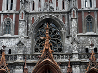 The panes above the entrance to the Roman Catholic Church of Saint Nicholas in Kyiv, Ukraine, on December 20, 2024, are smashed by the shock...