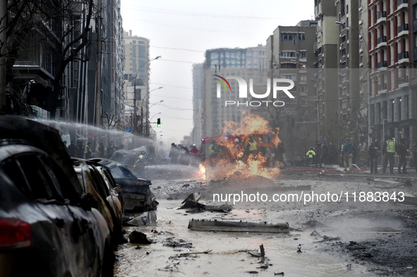 Firefighters put out a fire in the street in the Holosiivskyi district after a Russian missile attack in Kyiv, Ukraine, on December 20, 2024...