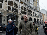 In Kyiv, Ukraine, on December 20, 2024, Kyiv city head Vitali Klitschko examines buildings in the Holosiivskyi district damaged by a Russian...