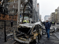 In Kyiv, Ukraine, on December 20, 2024, a man stands by a calcinated car in the Holosiivskyi district after a Russian missile attack. On Fri...