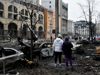 People look at damage caused by a Russian missile attack in the Holosiivskyi district, Kyiv, capital of Ukraine, on December 20, 2024. On Fr...