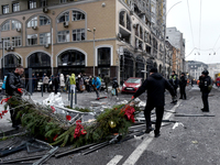 In Kyiv, Ukraine, on December 20, 2024, men remove Christmas decorations from the street in the Holosiivskyi district affected by a Russian...