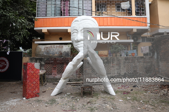 A sculpture is installed inside an alley during the open-air art festival, The Behala Art Fest, in Kolkata, India, on December 20, 2024. 