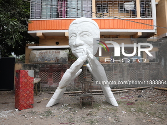 A sculpture is installed inside an alley during the open-air art festival, The Behala Art Fest, in Kolkata, India, on December 20, 2024. (