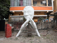 A sculpture is installed inside an alley during the open-air art festival, The Behala Art Fest, in Kolkata, India, on December 20, 2024. (