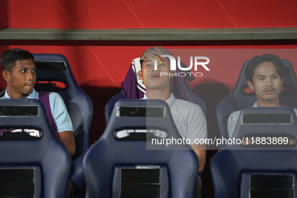 Vireak Dara sits on the substitutes bench during the Mitsubishi Electric Cup 2004 Group A match between Thailand and Cambodia at Rajamangala...