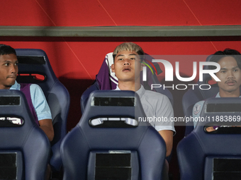 Vireak Dara sits on the substitutes bench during the Mitsubishi Electric Cup 2004 Group A match between Thailand and Cambodia at Rajamangala...