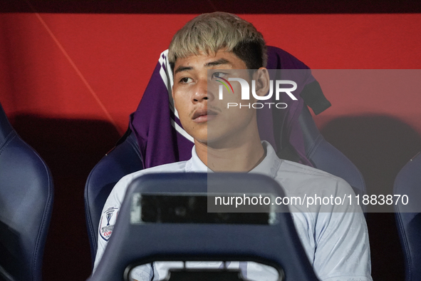 Vireak Dara sits on the substitutes bench during the Mitsubishi Electric Cup 2004 Group A match between Thailand and Cambodia at Rajamangala...