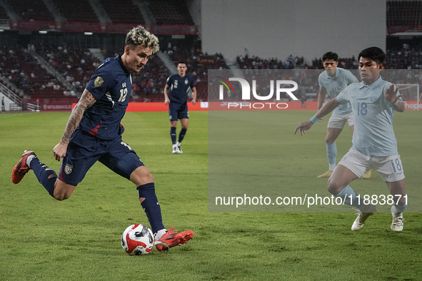 Nicholas Mickelson of Thailand plays against Seut Baraing of Cambodia during the Mitsubishi Electric Cup 2004 Group A match between Thailand...