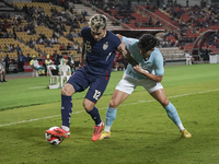 Nicholas Mickelson of Thailand plays against Nick Taylor of Cambodia during the Mitsubishi Electric Cup 2004 Group A match between Thailand...