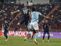 William Weidersjo of Thailand competes against Soeuy Visal of Cambodia during the Mitsubishi Electric Cup 2004 Group A match between Thailan...